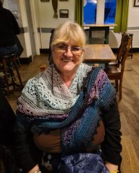 Fiona's crocheted shawl, modelled by Zoe - Knit & Natter Club - February 2023 - Green Man in Toppesfield