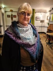 Fiona's crocheted shawl, modelled by Zoe - Knit & Natter Club - February 2023 - Green Man in Toppesfield