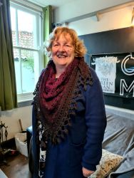 Fiona's crocheted shawl, modelled by Carolyn - Knit & Natter Club - April 2023 - Green Man in Toppesfield
