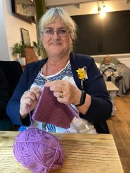Zoe knitting a blanket - Knit & Natter Club - November 2022 - Green Man in Toppesfield