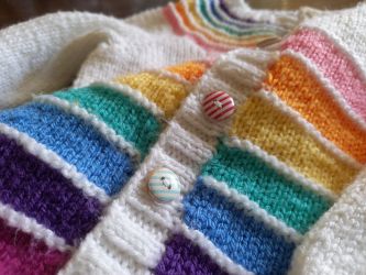 Rainbow yoke cardigan knitted by Carolyn